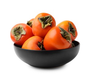 Delicious ripe juicy persimmons in bowl isolated on white