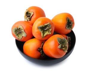 Photo of Delicious ripe juicy persimmons in bowl isolated on white