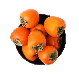 Delicious ripe juicy persimmons in bowl isolated on white, top view