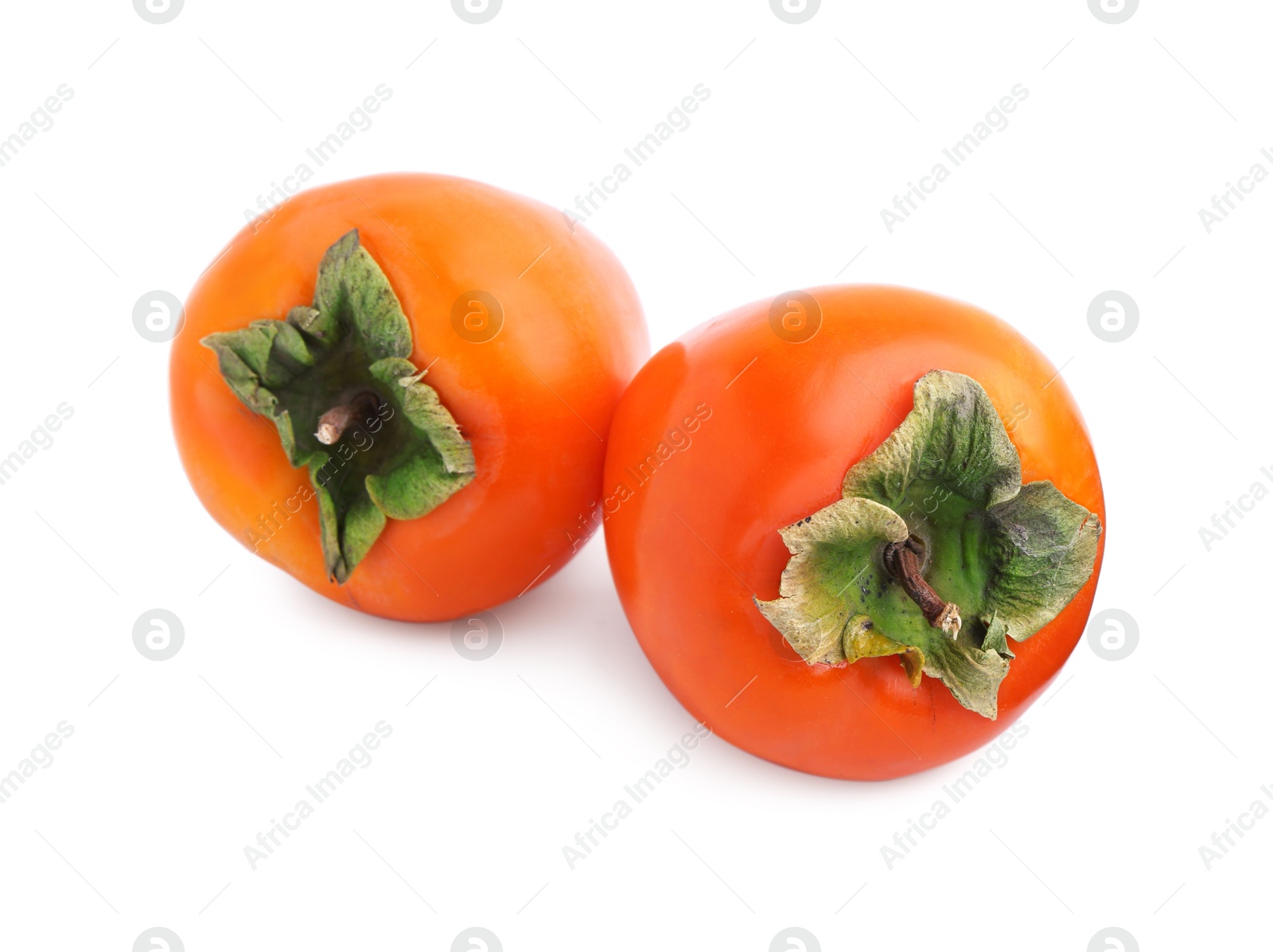 Photo of Delicious ripe juicy persimmons isolated on white