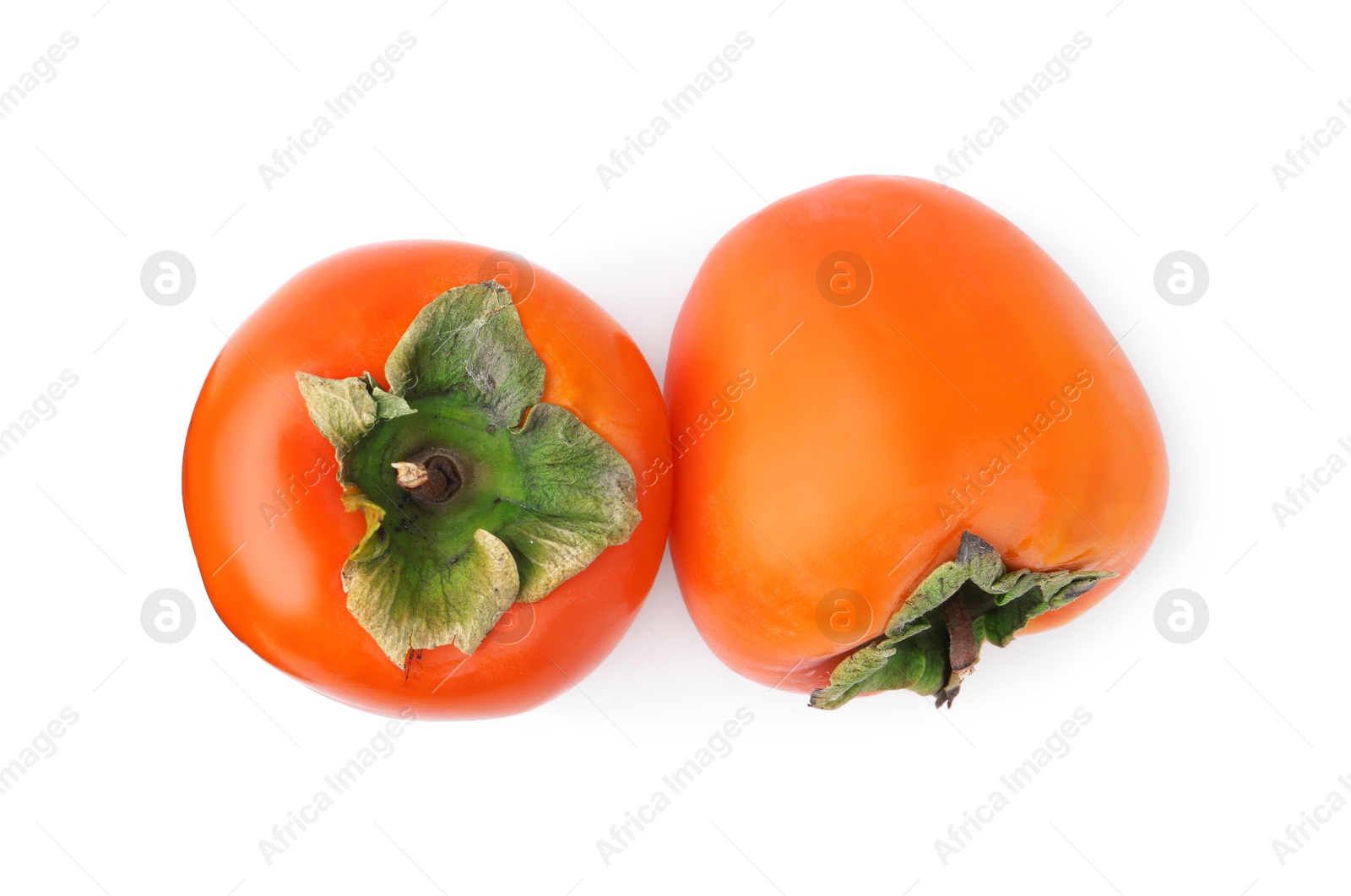 Photo of Delicious ripe juicy persimmons isolated on white, top view