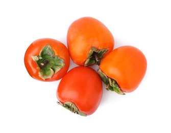 Photo of Delicious ripe juicy persimmons isolated on white, top view