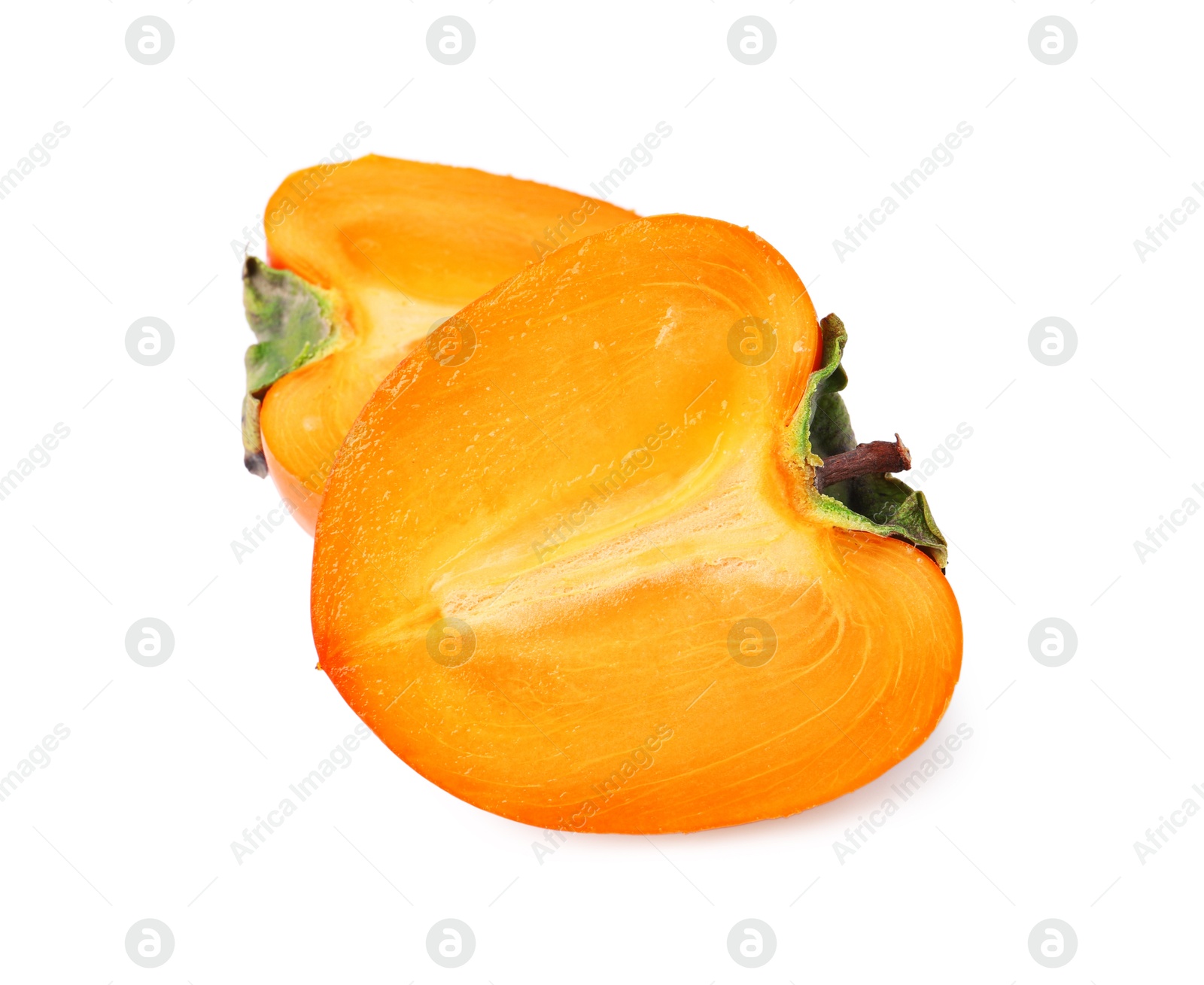 Halves of fresh juicy persimmon isolated on white Photo of Halves of fresh juicy persimmon isolated on white