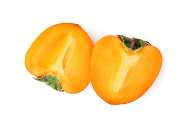 Photo of Halves of fresh juicy persimmon isolated on white, top view