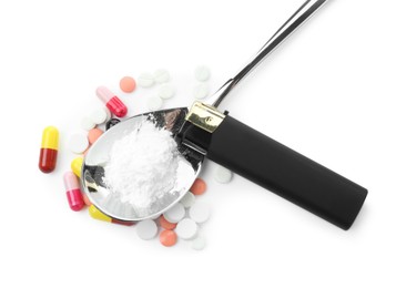 Photo of Drug addiction. Different pills, spoon with powder and cigarette lighter isolated on white, top view