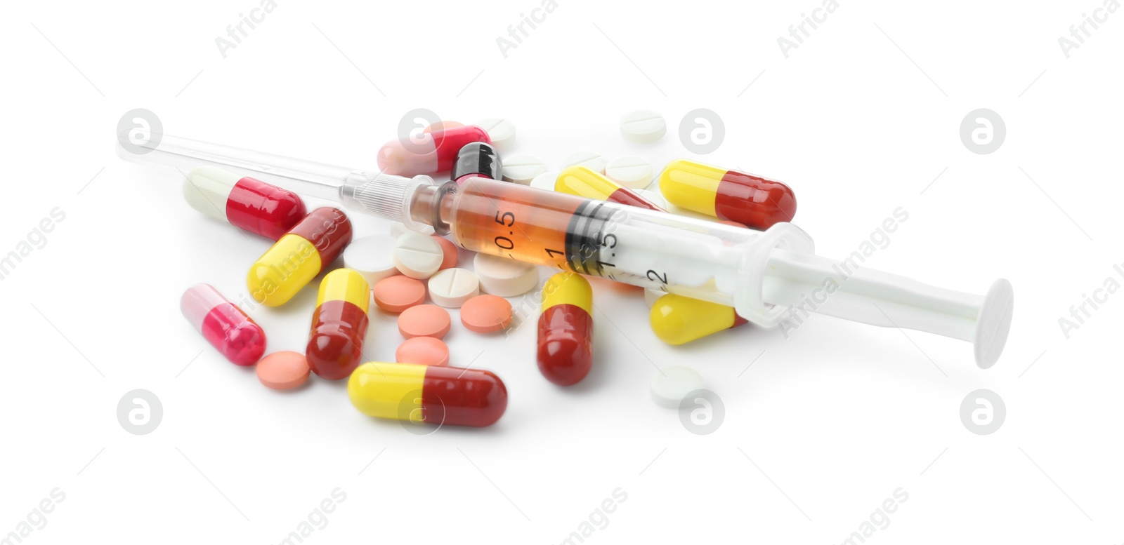 Photo of Drug addiction. Different pills and syringe isolated on white