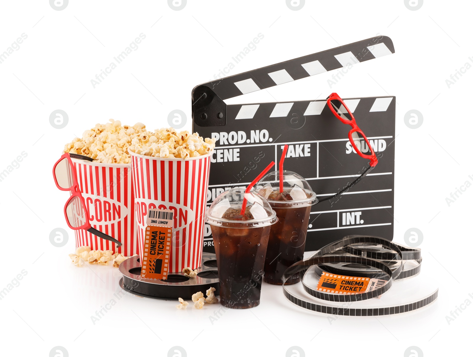 Photo of Tasty popcorn, glasses, film reels, soda drinks, clapper and movie tickets isolated on white