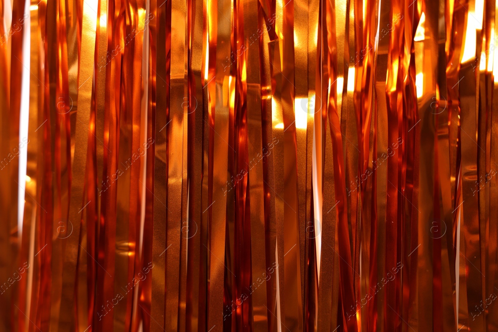 Photo of Shiny foil curtain as background, closeup view