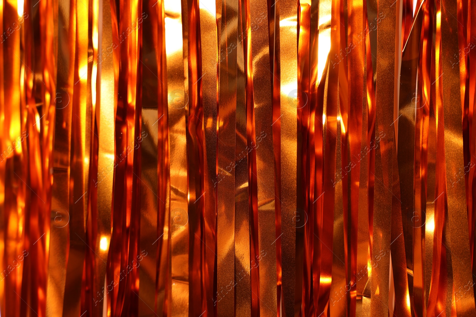 Photo of Shiny foil curtain as background, closeup view