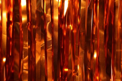 Photo of Shiny foil curtain as background, closeup view