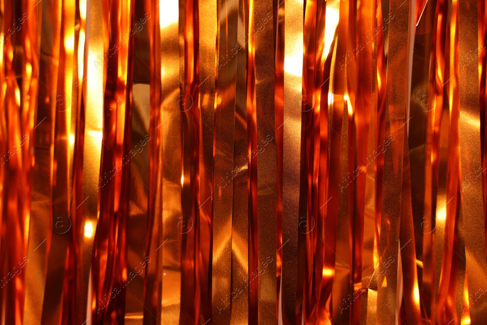 Photo of Shiny foil curtain as background, closeup view