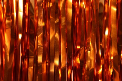 Photo of Shiny foil curtain as background, closeup view