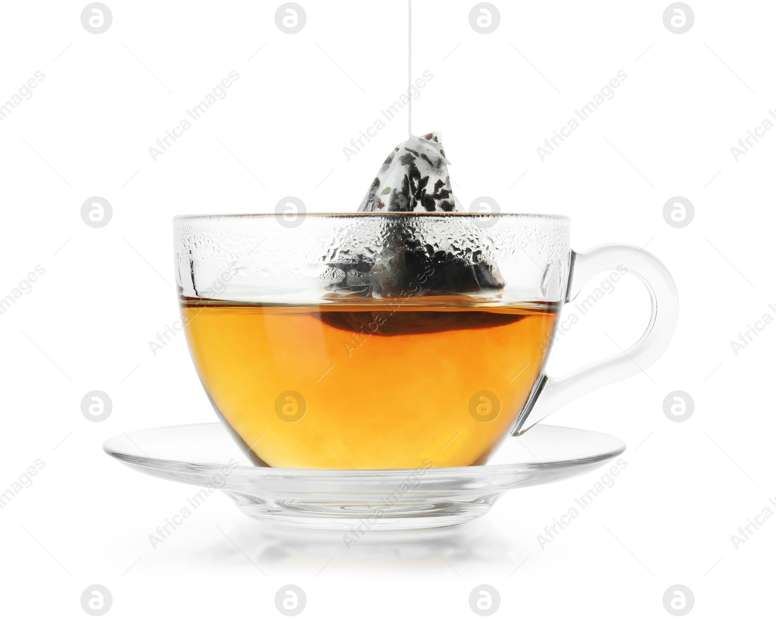 Photo of Cup with tea bag isolated on white