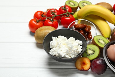 Photo of Different fresh products rich in serotonin on white wooden table