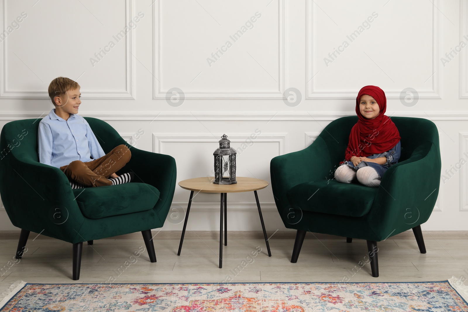 Photo of Muslim sister and brother spending time together at home