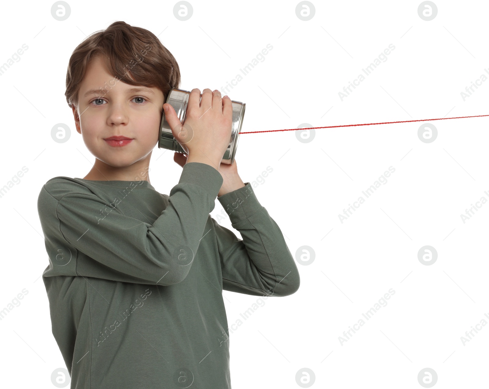 Photo of Boy using tin can telephone on white background