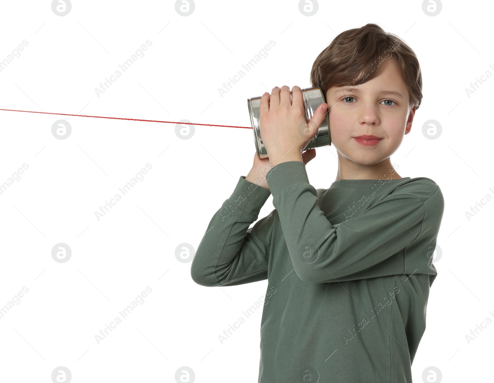 Photo of Boy using tin can telephone on white background