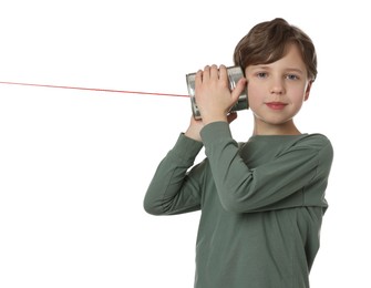 Photo of Boy using tin can telephone on white background