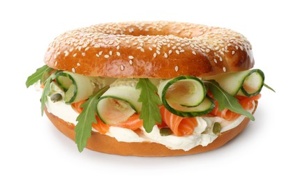 Photo of Delicious bagel with salmon, cream cheese and cucumber isolated on white