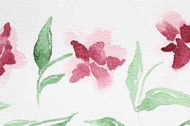 Photo of Watercolor painting of pink flowers and leaves on white paper, top view