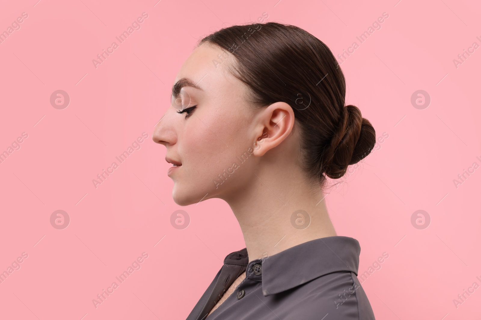 Photo of Portrait of beautiful woman on pink background