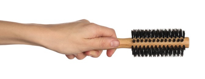 Photo of Woman with round wooden hair brush on white background, closeup