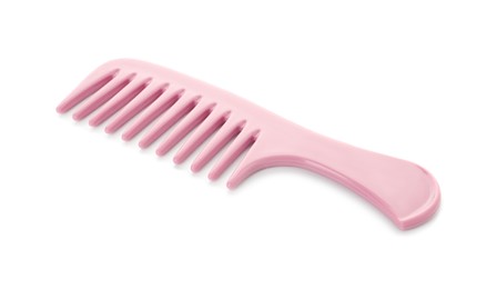 One pink plastic comb isolated on white