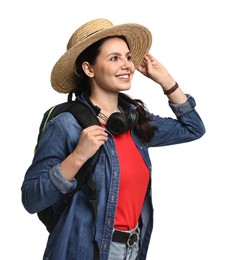 Photo of Young tourist in hat with backpack and headphones on white background