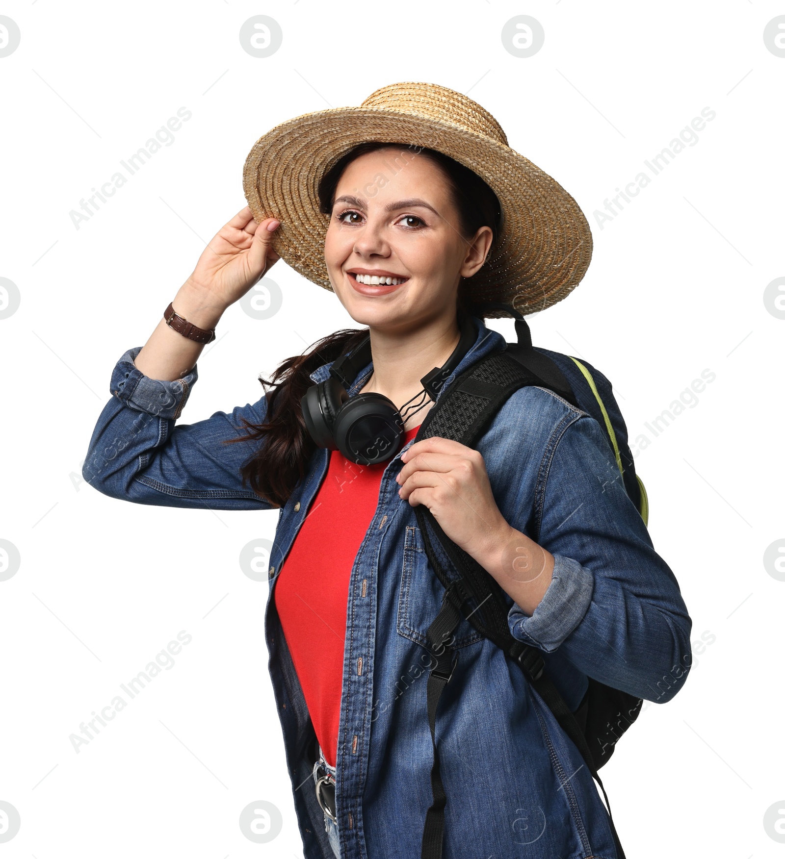 Photo of Young tourist in hat with backpack and headphones on white background