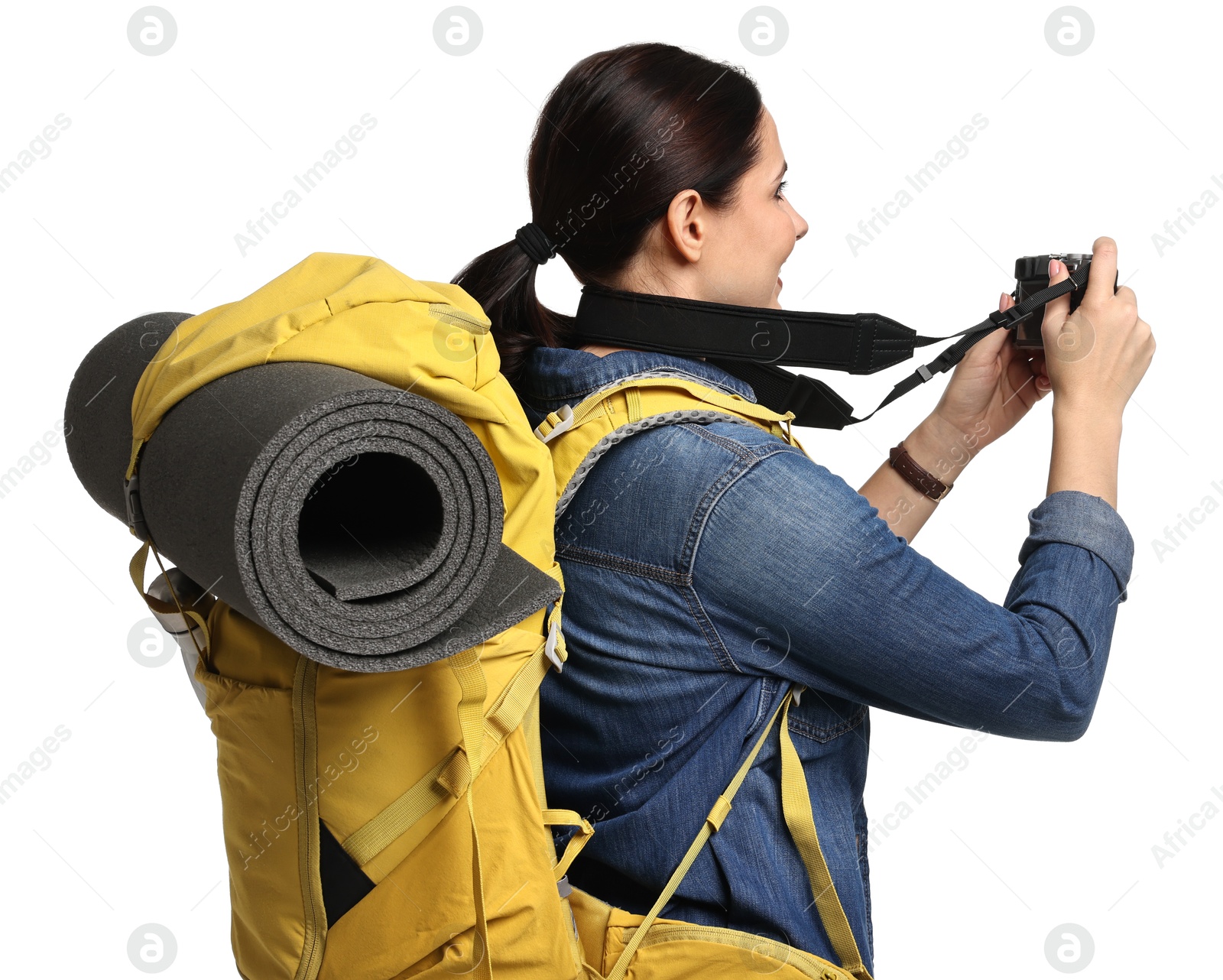 Photo of Young tourist with camera and backpack on white background