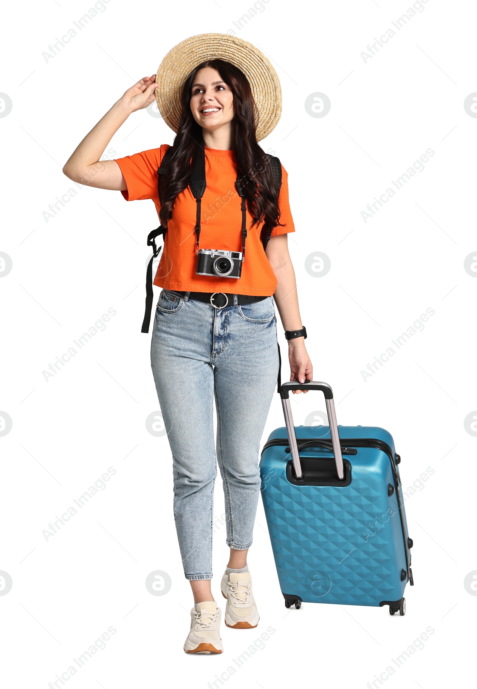 Photo of Young tourist in hat with camera, suitcase and backpack on white background