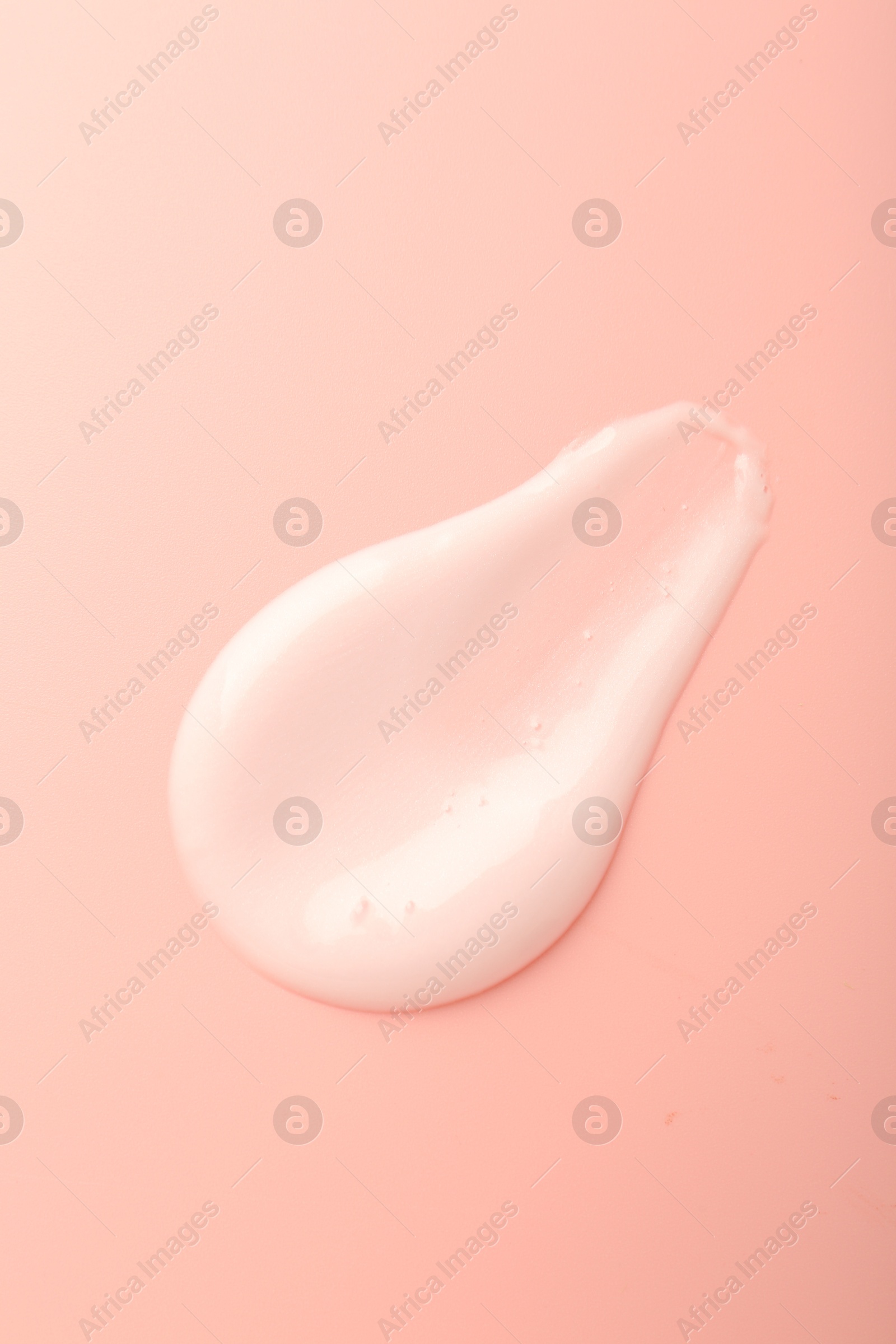 Photo of Cream sample on pink background, top view