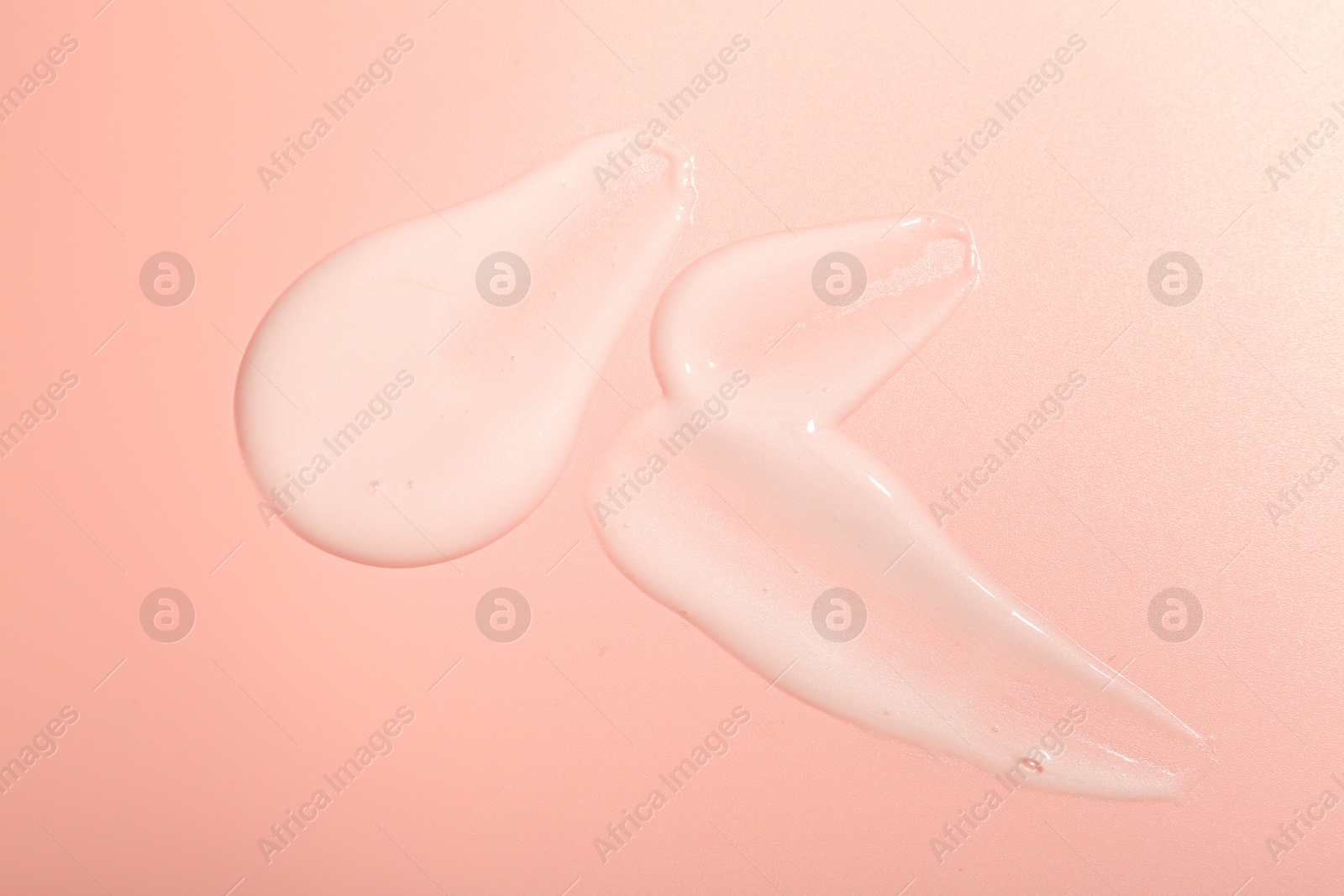 Photo of Cream samples on pink background, top view