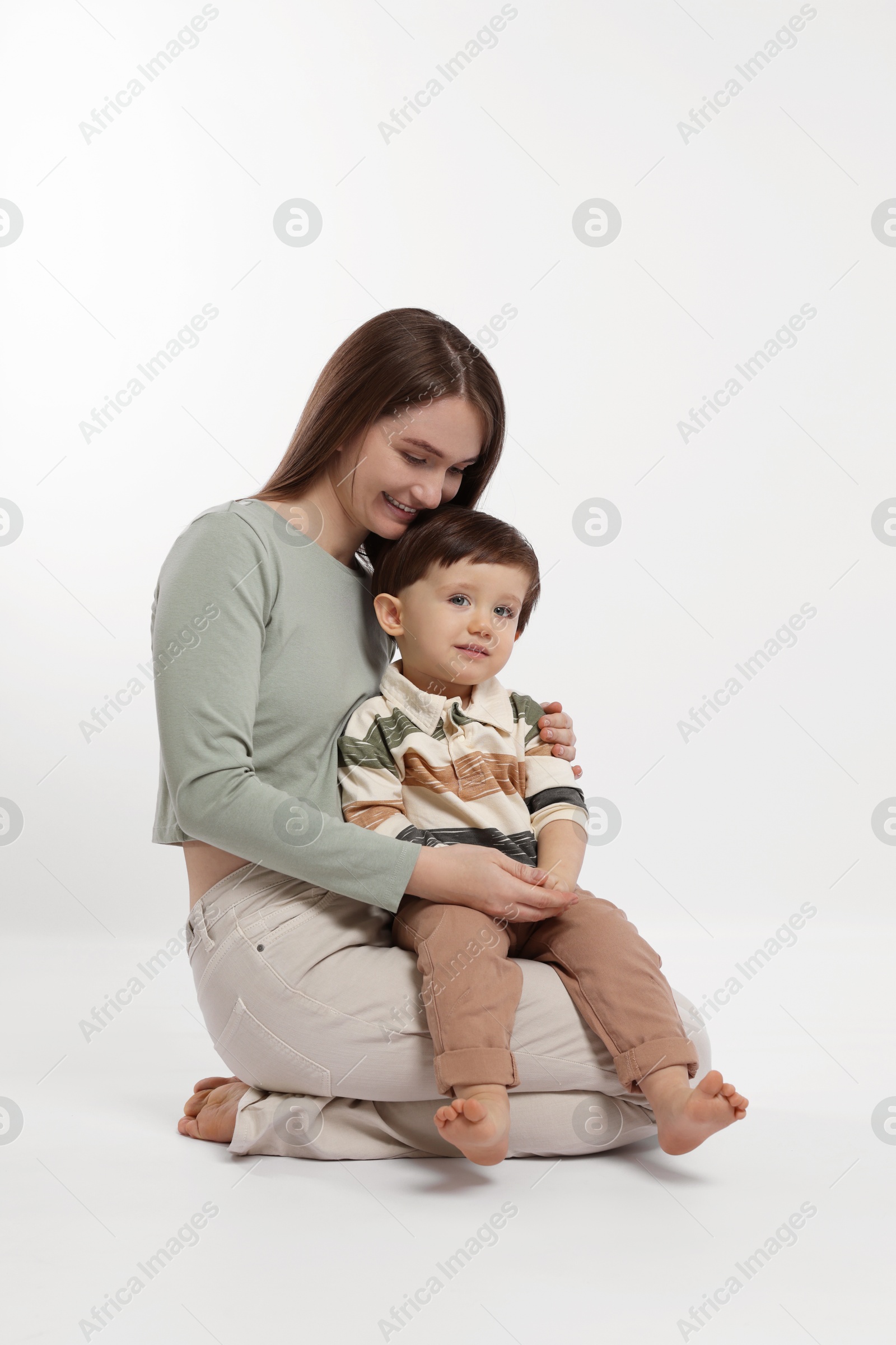 Photo of Happy mother with her cute little son on white background