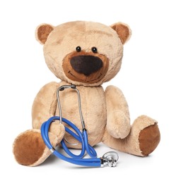 Photo of Pediatrics concept. Teddy bear and stethoscope isolated on white