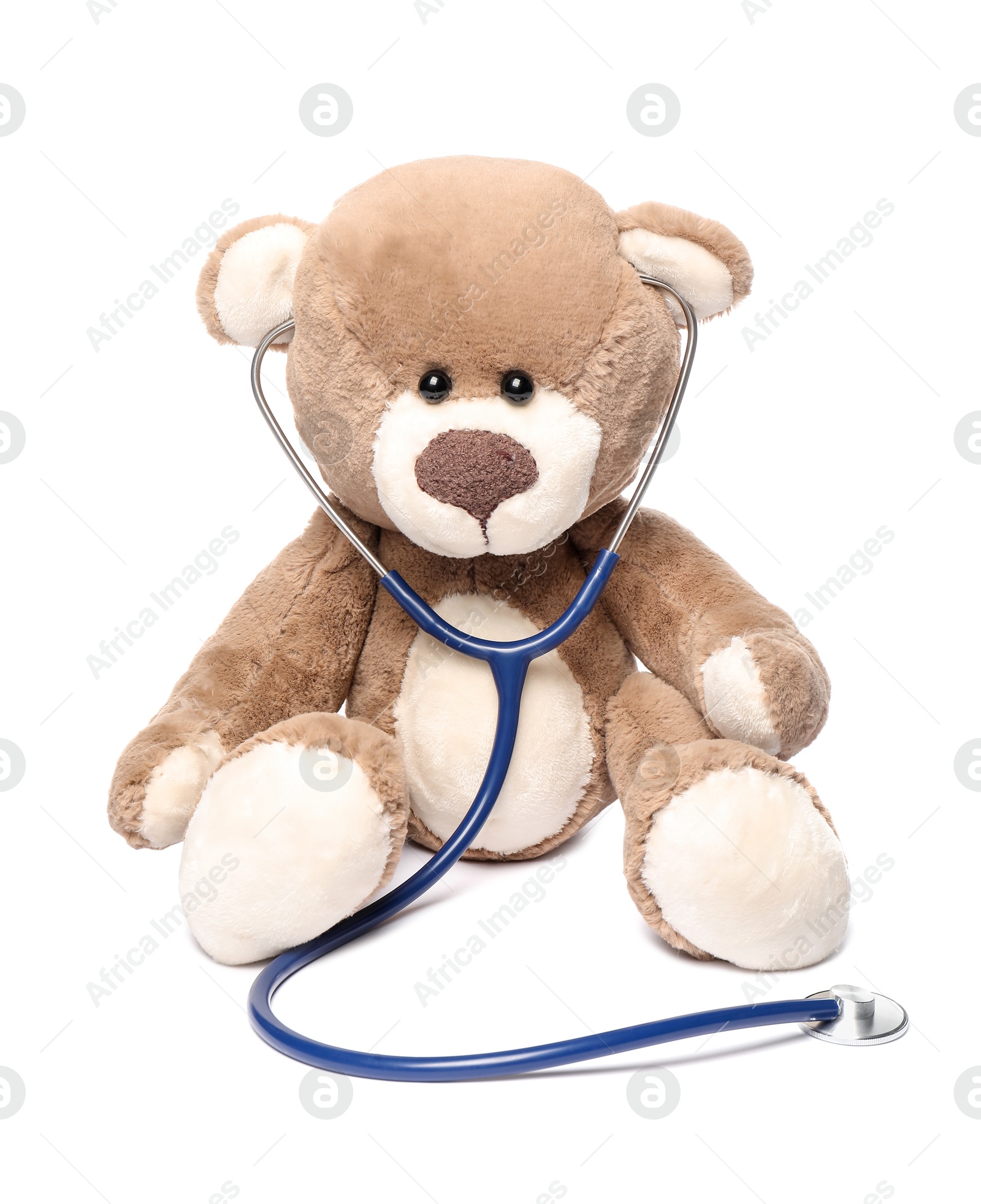 Photo of Pediatrics concept. Teddy bear with stethoscope isolated on white