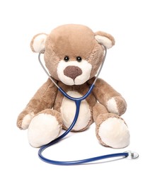 Photo of Pediatrics concept. Teddy bear with stethoscope isolated on white