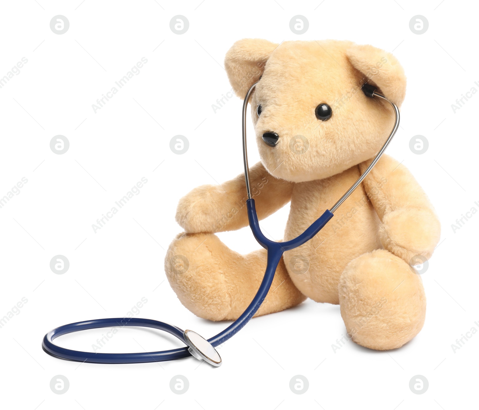 Photo of Pediatrics concept. Teddy bear with stethoscope isolated on white