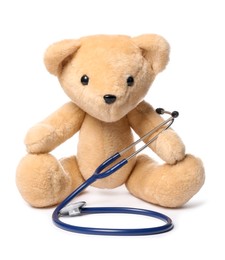 Photo of Pediatrics concept. Teddy bear with stethoscope isolated on white