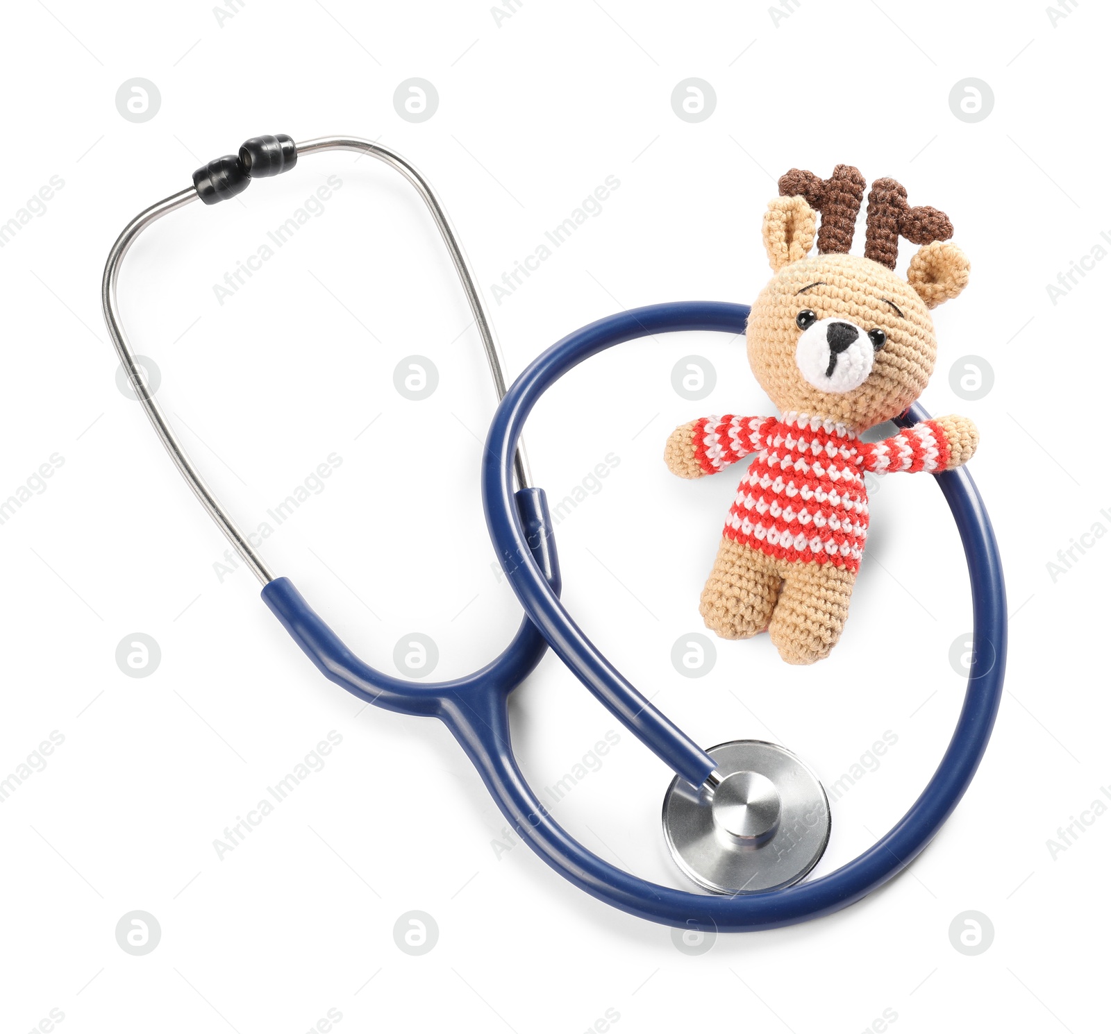 Photo of Pediatrics concept. Toy deer with stethoscope isolated on white, top view