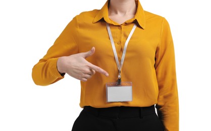 Photo of Woman pointing at her blank badge on white background, closeup