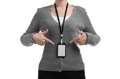 Photo of Woman pointing at her blank badge on white background, closeup