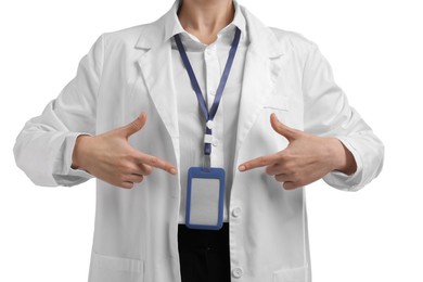 Photo of Doctor pointing at her badge on white background, closeup