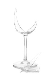 Photo of Pieces of broken wine glass isolated on white