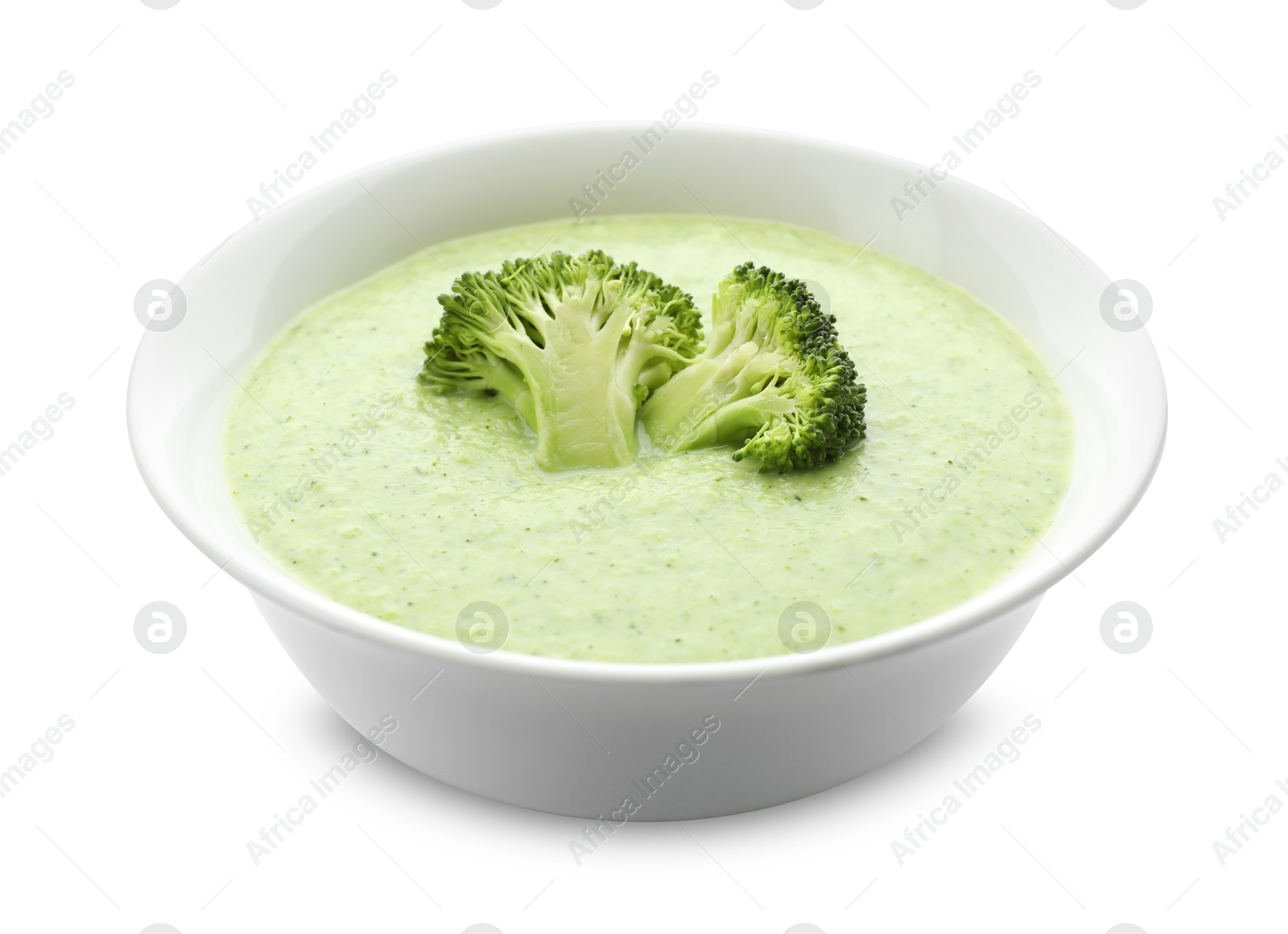 Photo of Delicious broccoli cream soup in bowl isolated on white