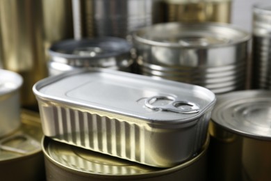 Photo of Many closed tin cans as background, closeup