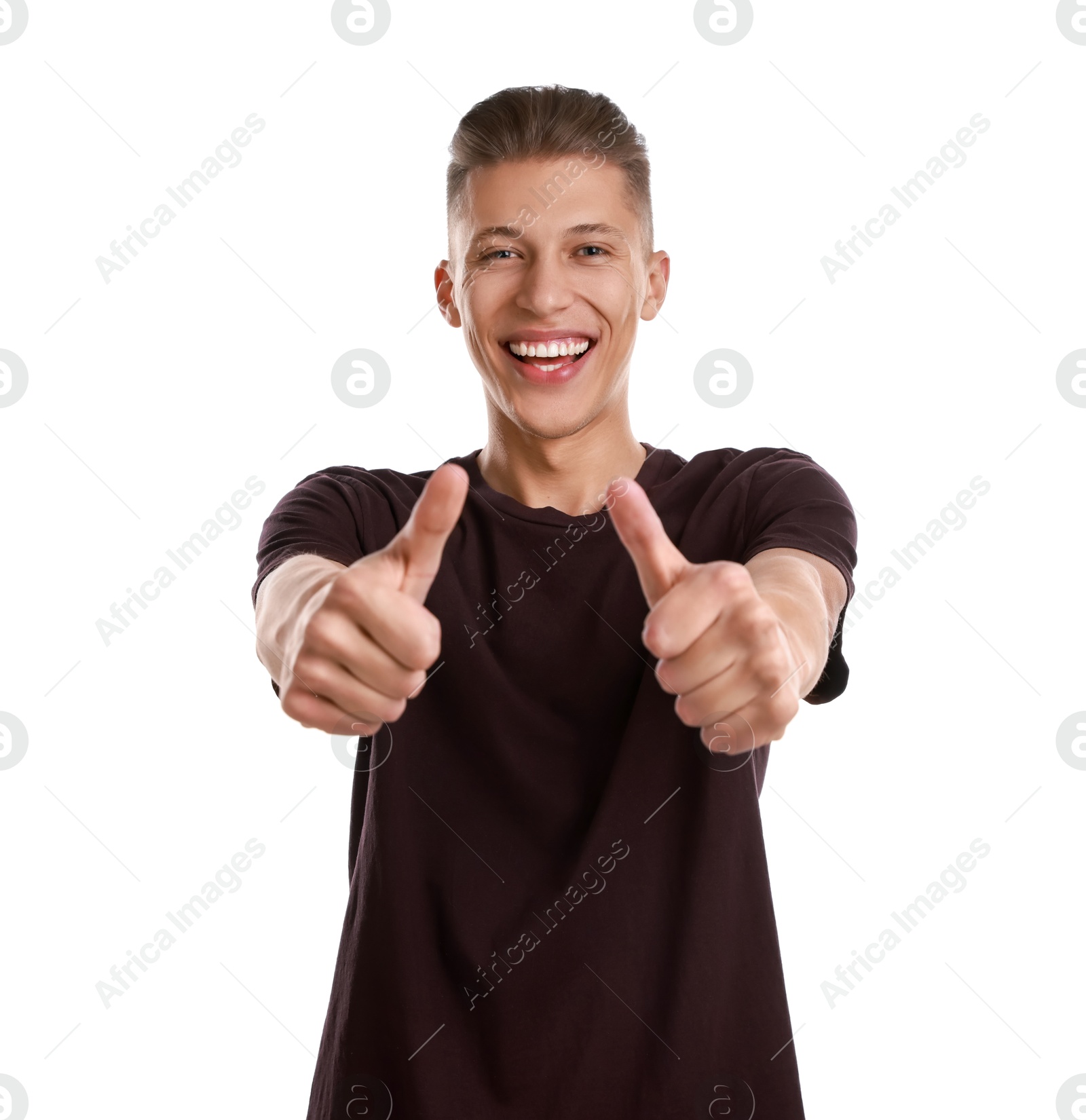 Photo of Happy man showing thumbs up on white background. Like gesture