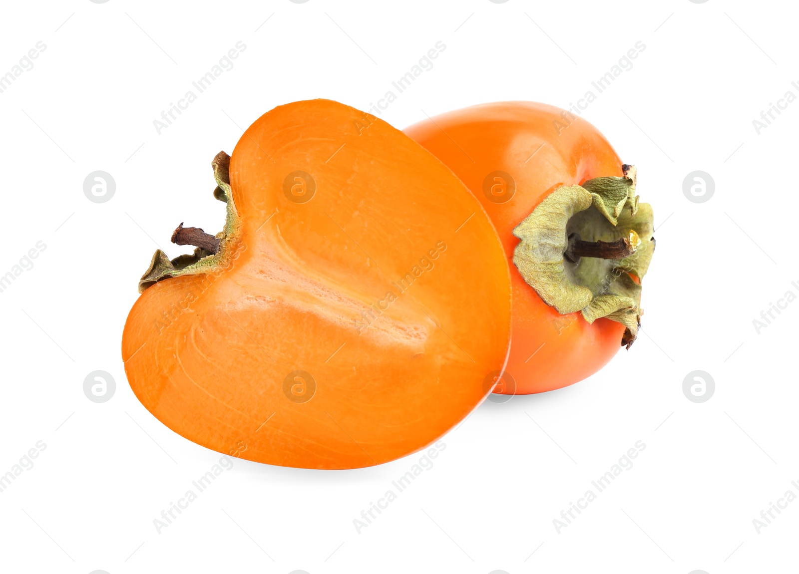 Photo of Whole and cut fresh persimmons isolated on white