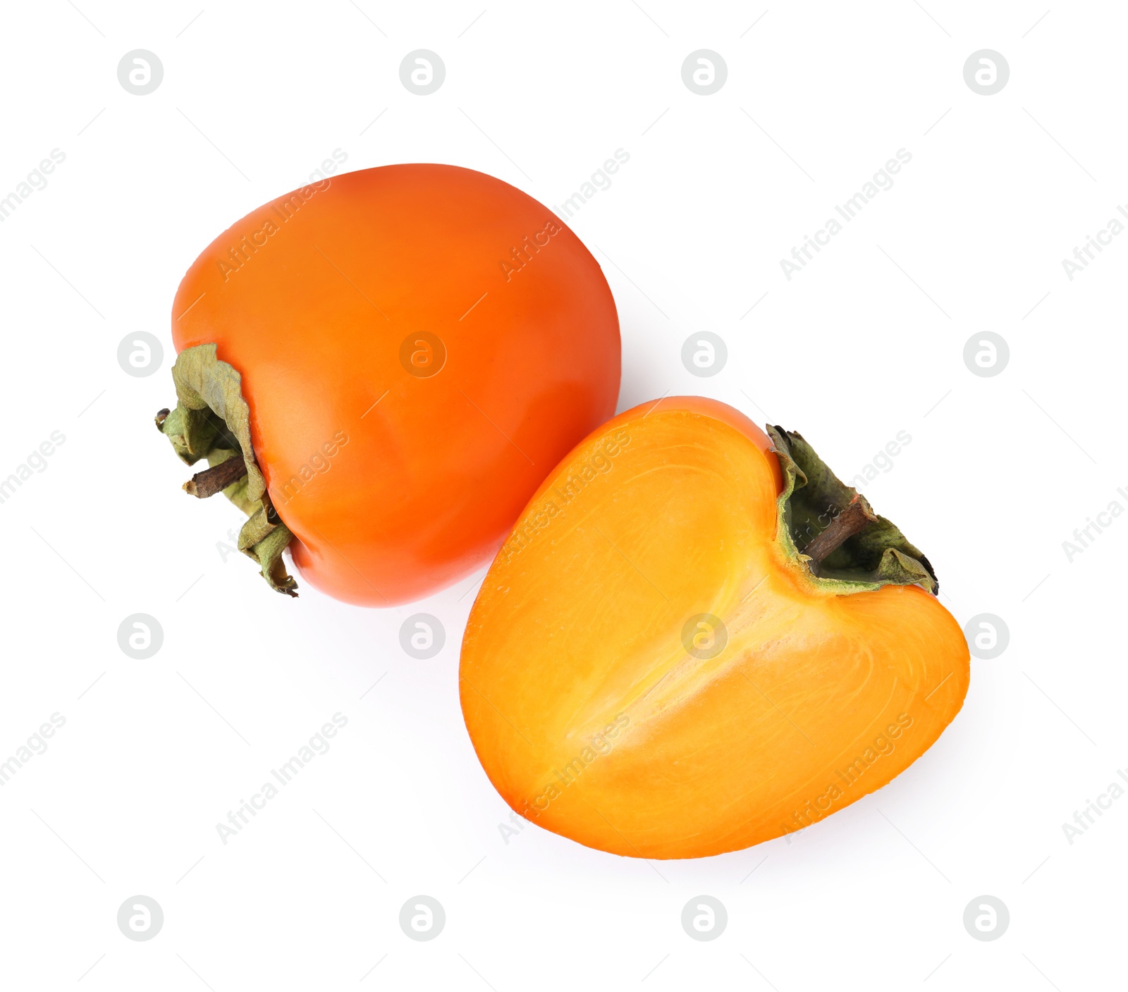 Photo of Whole and cut fresh persimmons isolated on white, top view