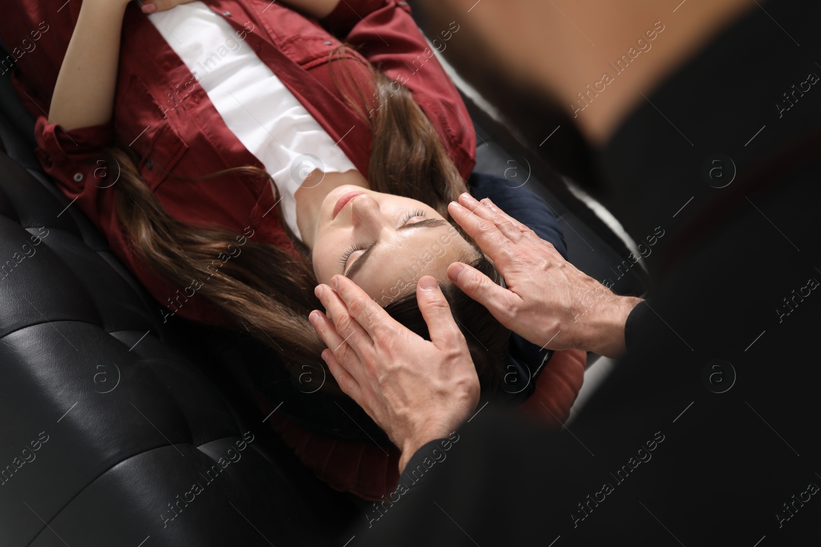 Photo of Psychologist working with patient during hypnosis session indoors, above view